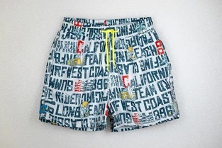 TORTUE bermuda swimsuit with printed letters.