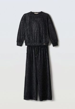 EVITA velvet pants set in black with glitter.