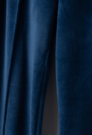 EBITA velor jumpsuit set in blue with "WAKE UP" logo embossed.