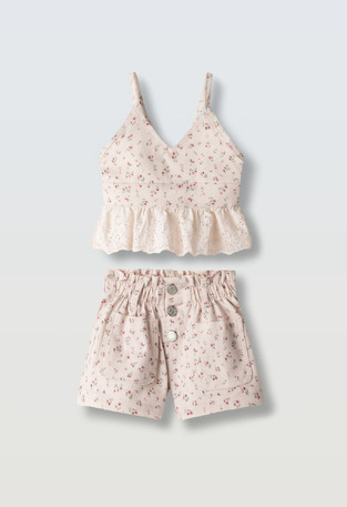 EVITA shorts set in light pink with floral print.