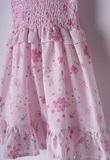 EBITA dress in pink color with floral design.