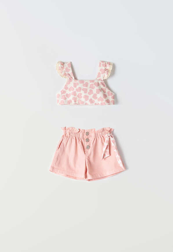 Set of EBITA denim shorts in pink color with heart pattern.