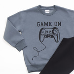 Gray TRAX tracksuit set with embossed "GAME ON" logo.