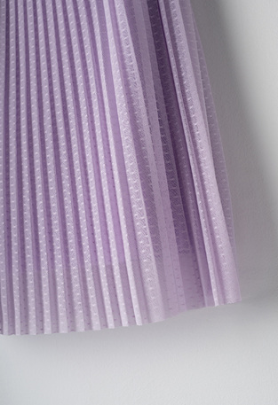 EBITA tulle dress in lilac color with all over pattern of pleats.