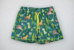 TORTUE bermuda swimsuit with dinosaur print.