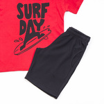 TRAX shorts set in red with "SURF DAY" logo.