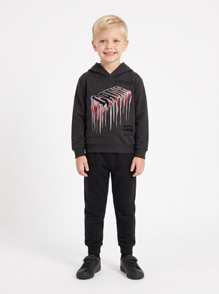 TRAX seasonal tracksuit set in charcoal and black.