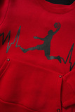SPRINT tracksuit set in red with an embossed print in a basketball player design.