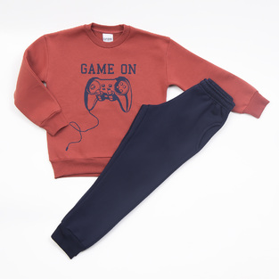 TRAX tracksuit set in brick color with embossed "GAME ON" logo.