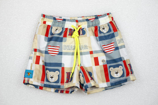 TORTUE bermuda swimsuit with teddy bear print.