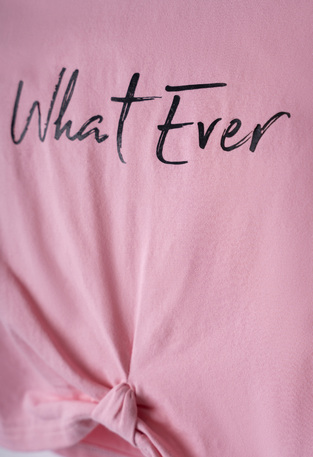EBITA T-shirt in pink with "WHAT EVER" logo.