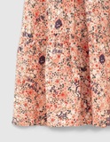 IKKS skirt in salmon color with floral design.