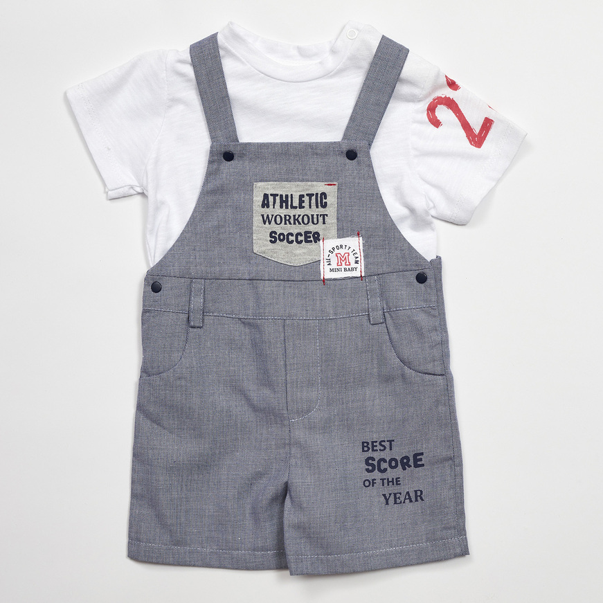 MINI dungarees in blue with appliqué embroidery.