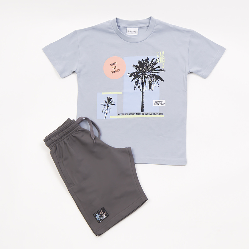 TRAX shorts set in gray with tropical print relief.