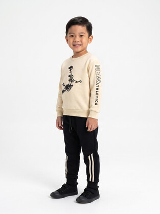 TRAX jumpsuit set in ecru-black.