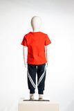 JOYCE seasonal tracksuit set, red top and printed tracksuit pants.