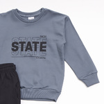 TRAX tracksuit set in Indian gray color with "STATE" logo.