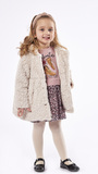 EBITA fur in beige color with all over polka dot pattern.