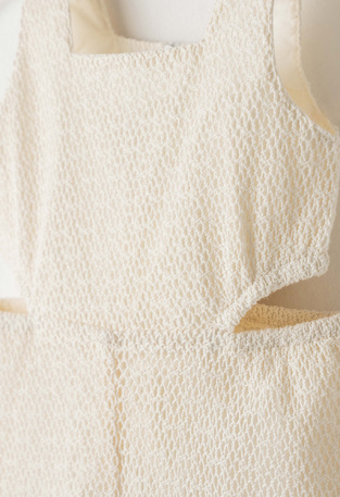 EBITA jumpsuit with matching ribbon in off-white color.