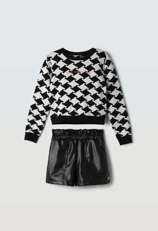 EVITA shorts set in white-black with leather texture.