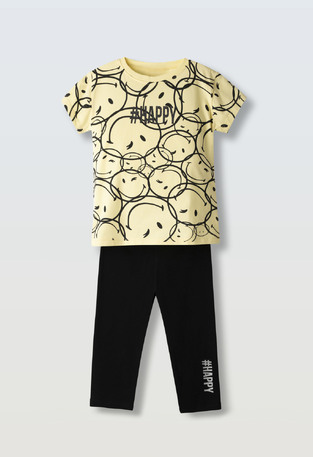 EVITA capri leggings set in yellow with all-over print.