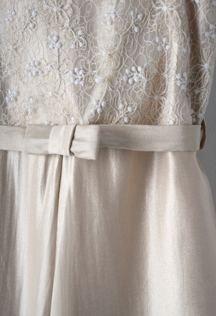 EBITA jumpsuit in beige metallic color with lace details.