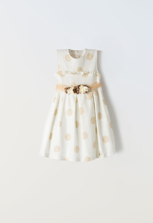 EBITA dress in ivory color with polka dot pattern.