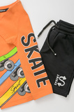 SPRINT shorts set in orange color with embossed skate print.
