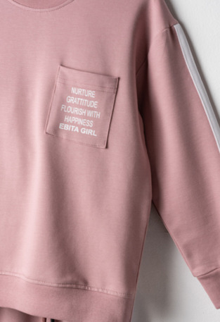 EVITA seasonal tracksuit set in pink.