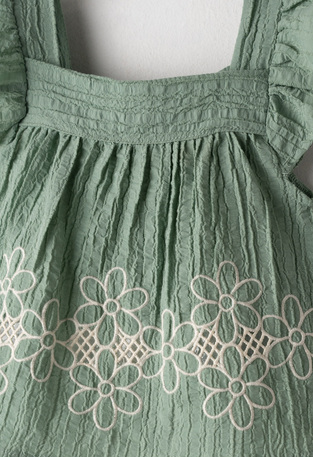 EVITA denim shorts set in olive green and light blue.