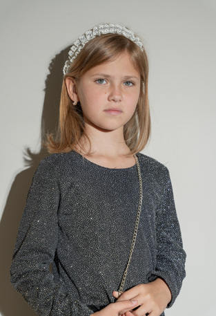 EBITA dress in black with glitter and matching bag.