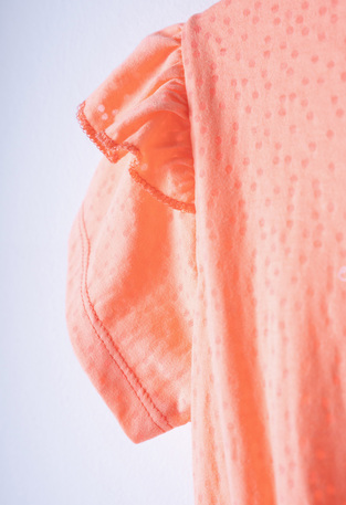 EBITA shorts set in orange color with embossed beach print.