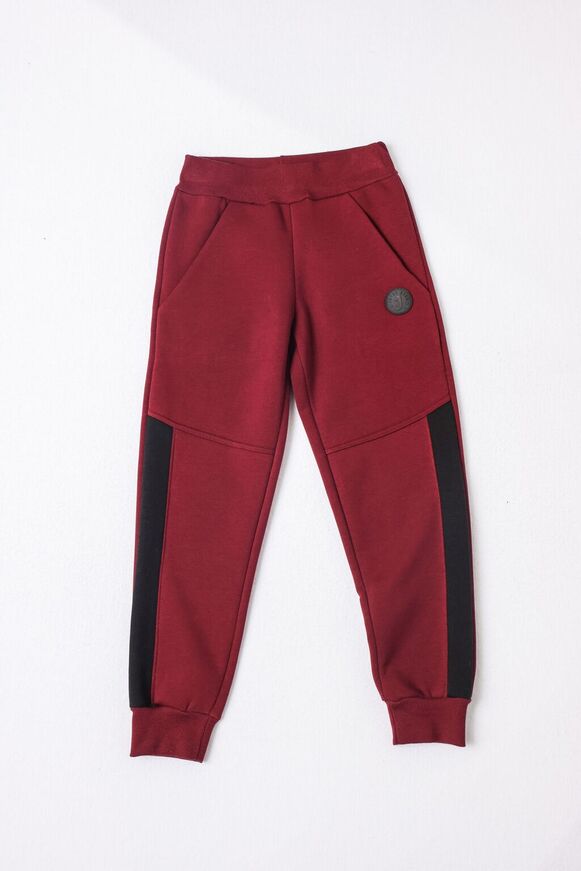 JOYCE sweatpants in burgundy color with elastic waist.