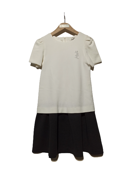 MARASIL dress in off-white color with black trim.