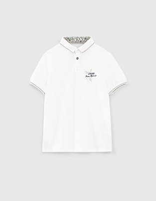 Ikks pique polo shirt in white color with embroidery.