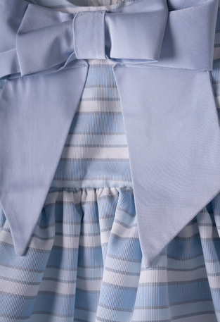 EBITA dress in siel color with striped design and impressive bow.