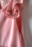 EBITA jumpsuit in pink color with a pleated design.