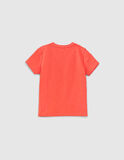 IKKS blouse in orange color with trunks on the side.