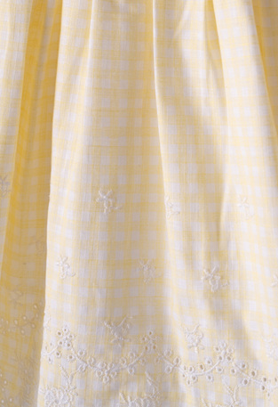 EBITA dress in yellow color with check pattern.