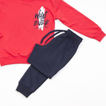 Seasonal TRAX tracksuit set in red with "WHAT EVER MAKES YOU HAPPY" logo.