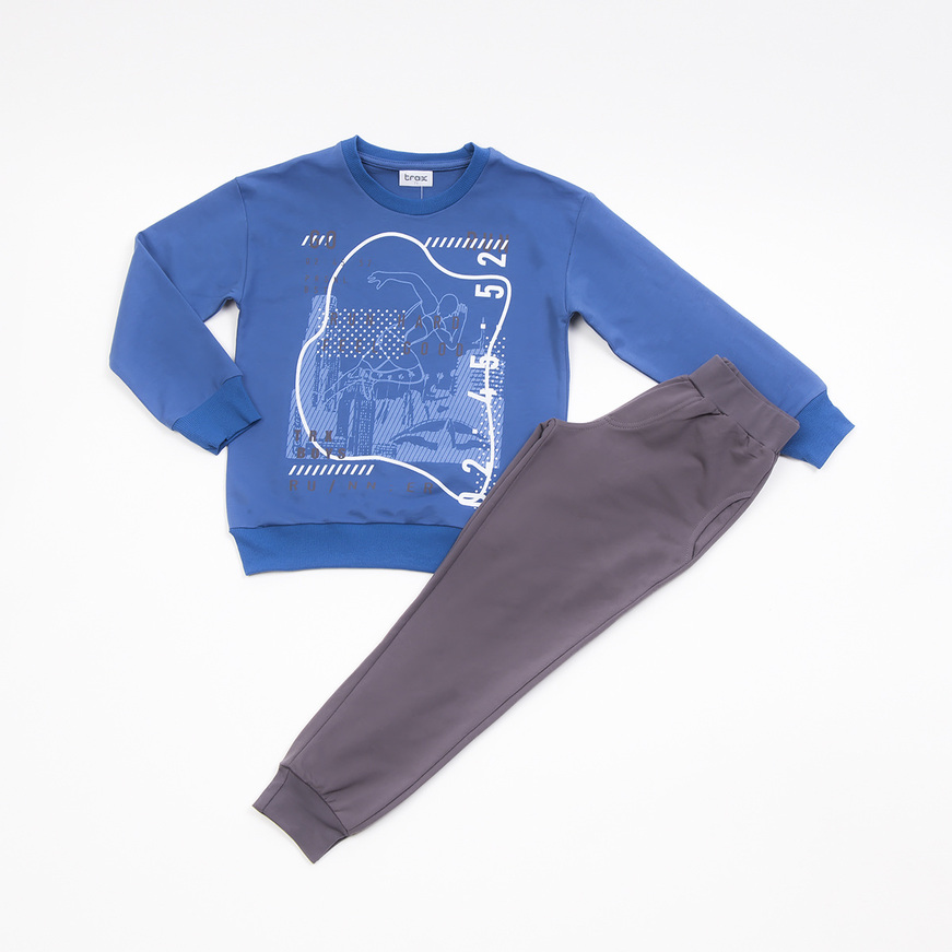 TRAX seasonal tracksuit in blue raff color with embossed print.