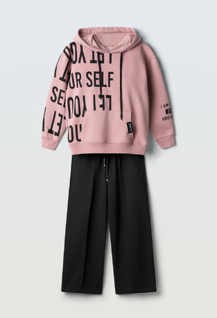 Evita seasonal jumpsuit set in pink and black.