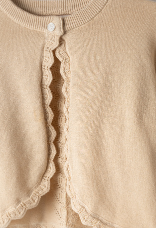 Ζακέτα μπολερό ΕBΙΤΑ σε χρώμα μπεζ.