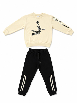 TRAX jumpsuit set in ecru-black.