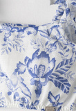 Σετ παντελόνα ΕΒΙΤΑ σε λευκό χρώμα με floral print και ασορτί τσαντάκι.