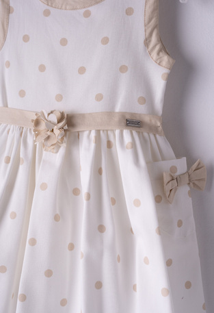 EBITA dress in off-white color with all over beige polka dot pattern.