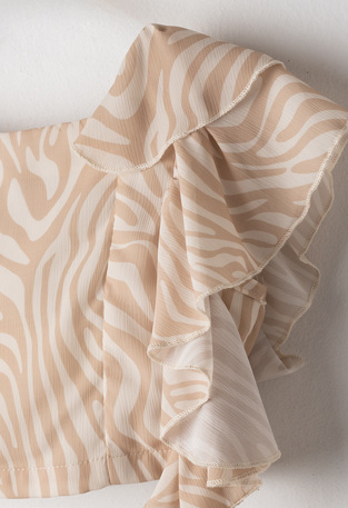 EVITA shorts set in ecru with light brown.