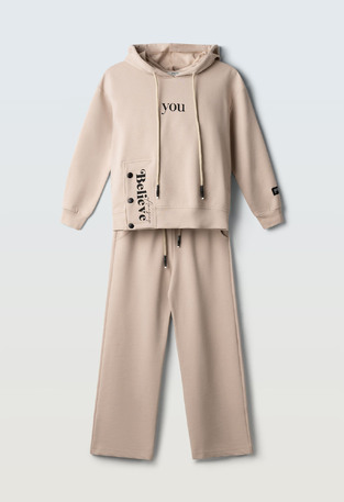 Evita seasonal jumpsuit set in beige.