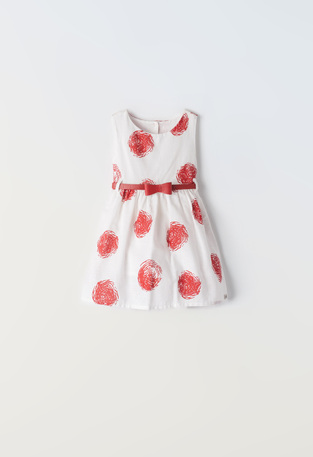 EBITA dress in off-white color with red polka dot pattern.