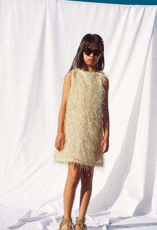 EBITA dress in beige color with feathers.